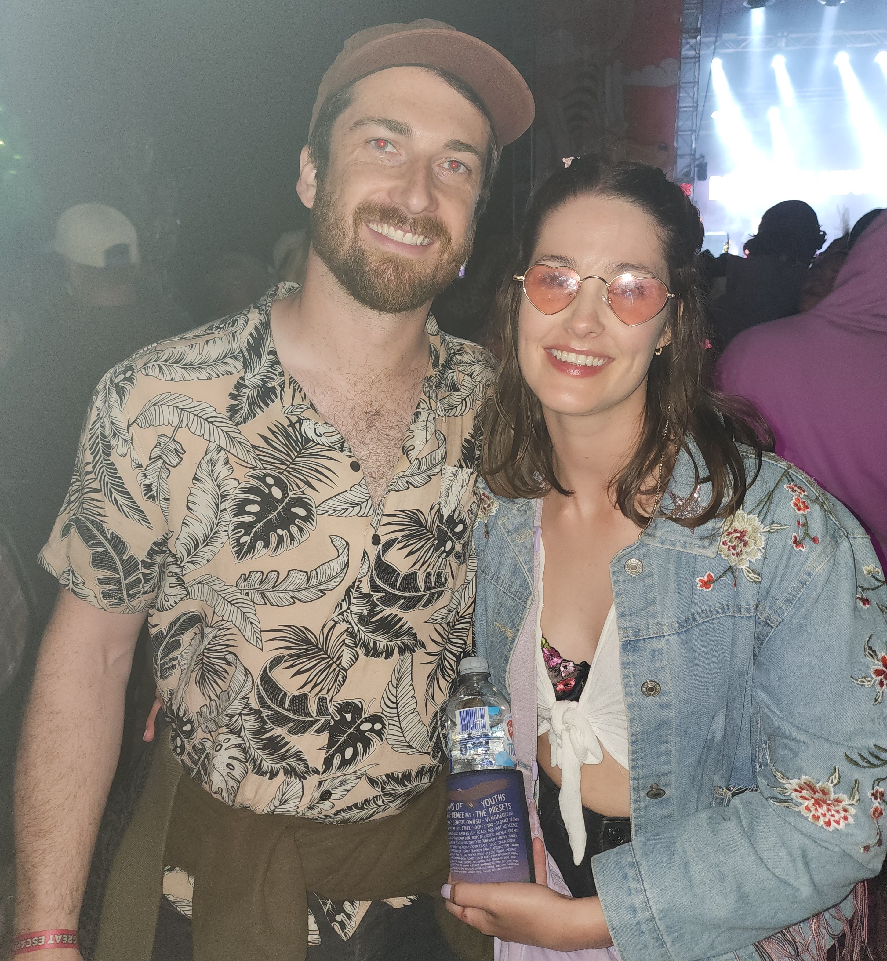Alex and Alice smiling together on their wedding day